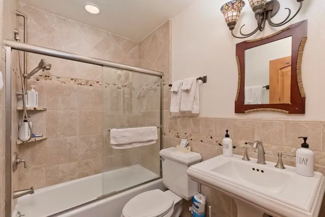 a living room with furniture and wooden floors