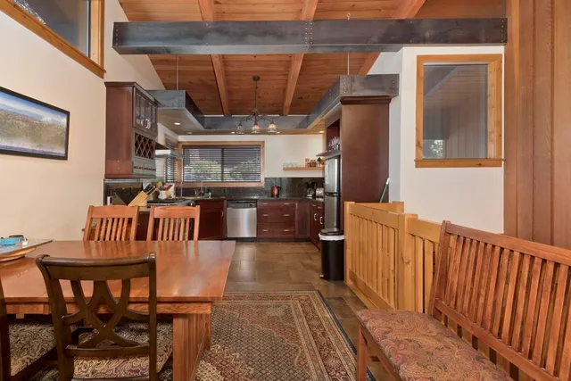 a view of a chairs and table in a balcony
