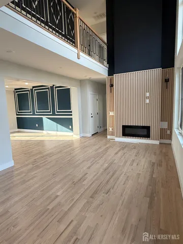 a view of a house with wooden deck