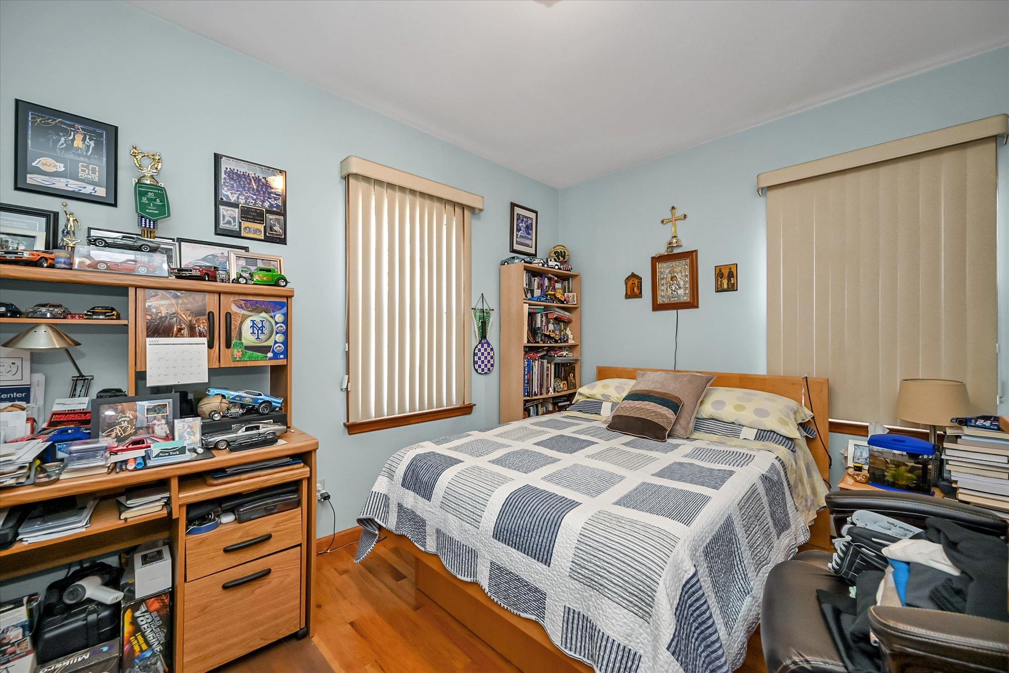 45-39 192nd Street Queens, NY 11358 - Photo 16 of 23 a bedroom with a bed and a window