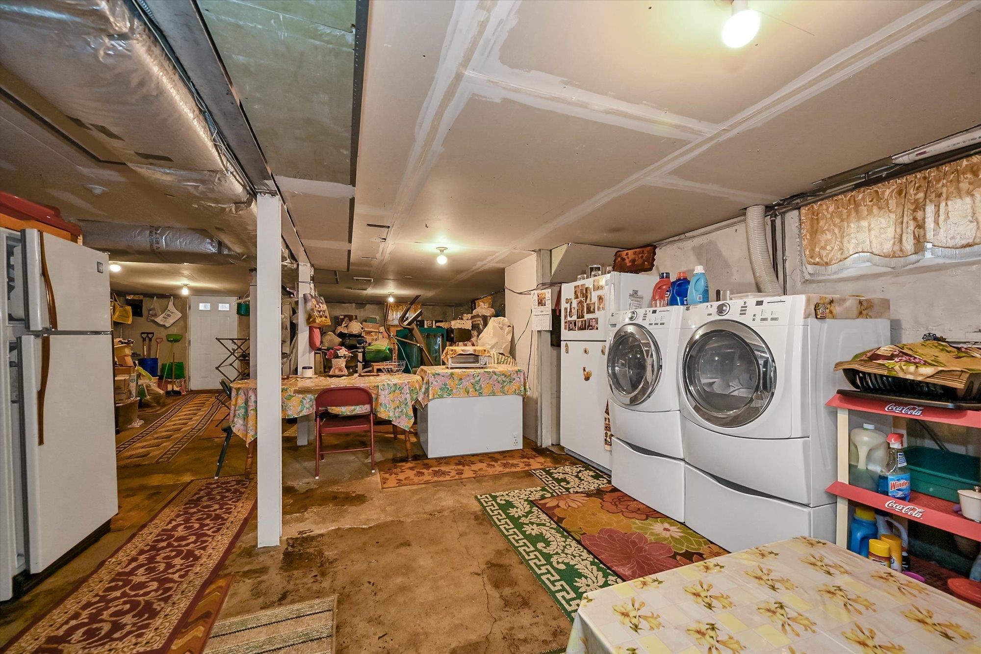 45-39 192nd Street Queens, NY 11358 - Photo 18 of 23 a storage room with washer and dryer