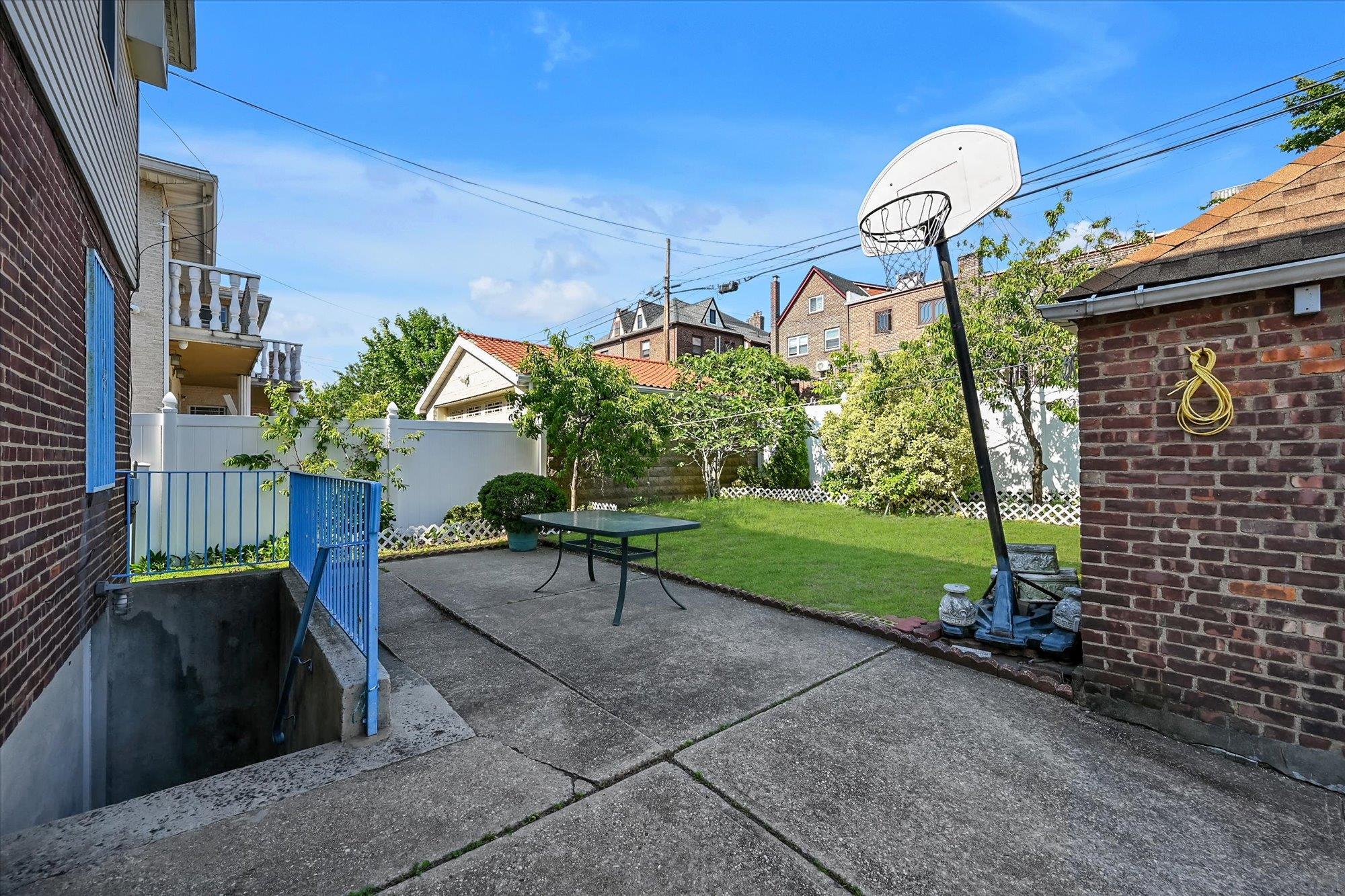 45-39 192nd Street Queens, NY 11358 - Photo 22 of 23 a front view of a house with garden