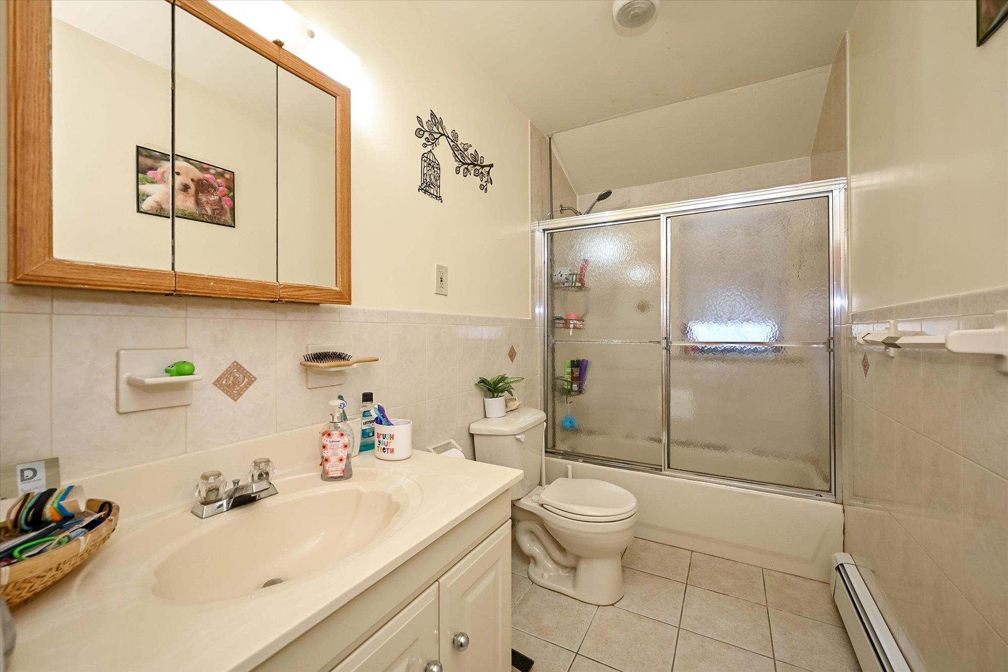 45-39 192nd Street Queens, NY 11358 - Photo 10 of 23 a bathroom with a sink toilet and shower