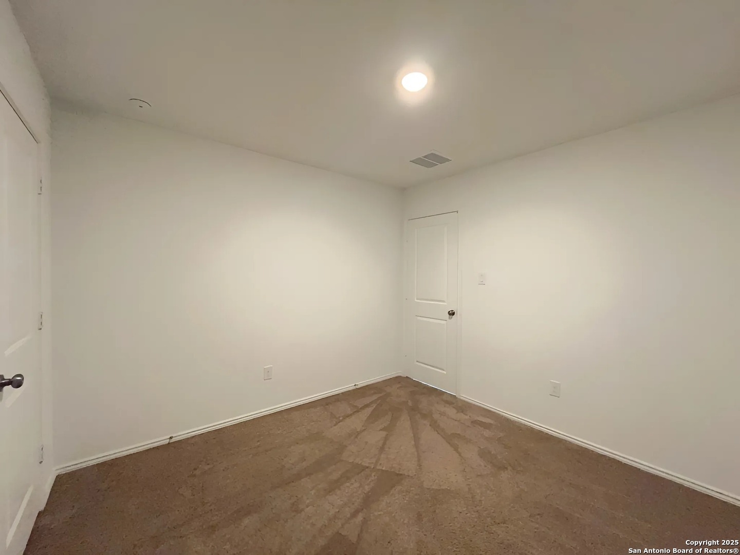 6954 Biotite Ridge Elmendorf, TX 78112 - Photo 20 of 39 an empty room with a workbench