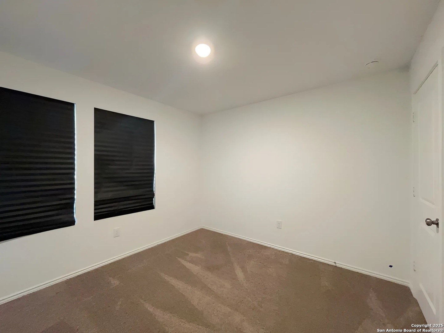 6954 Biotite Ridge Elmendorf, TX 78112 - Photo 23 of 39 a view of an empty room with a window