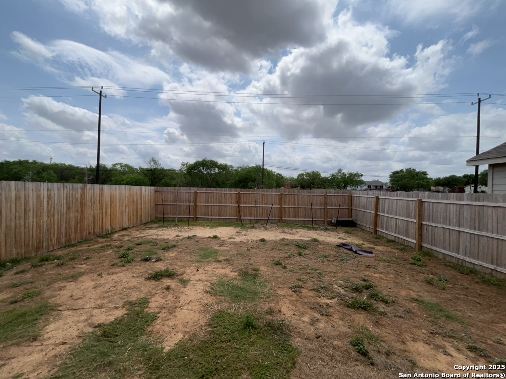 6954 Biotite Ridge Elmendorf, TX 78112 - Photo 27 of 39 a view of a backyard