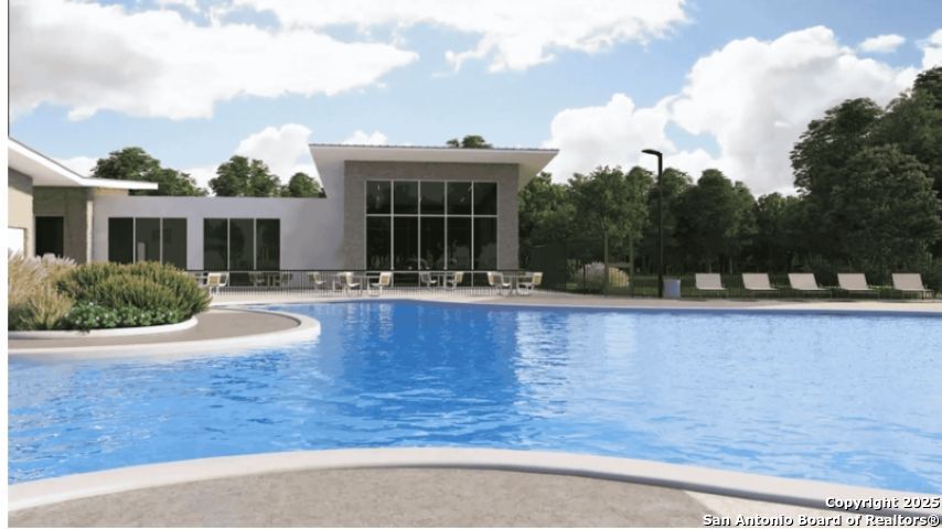 6954 Biotite Ridge Elmendorf, TX 78112 - Photo 33 of 39 a view of a house with a yard