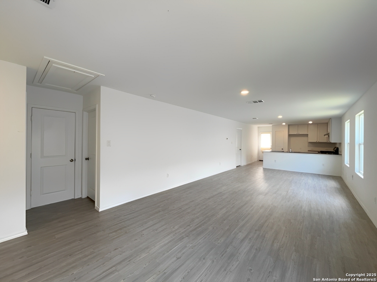 6954 Biotite Ridge Elmendorf, TX 78112 - Photo 7 of 39 a view of empty room with wooden floor
