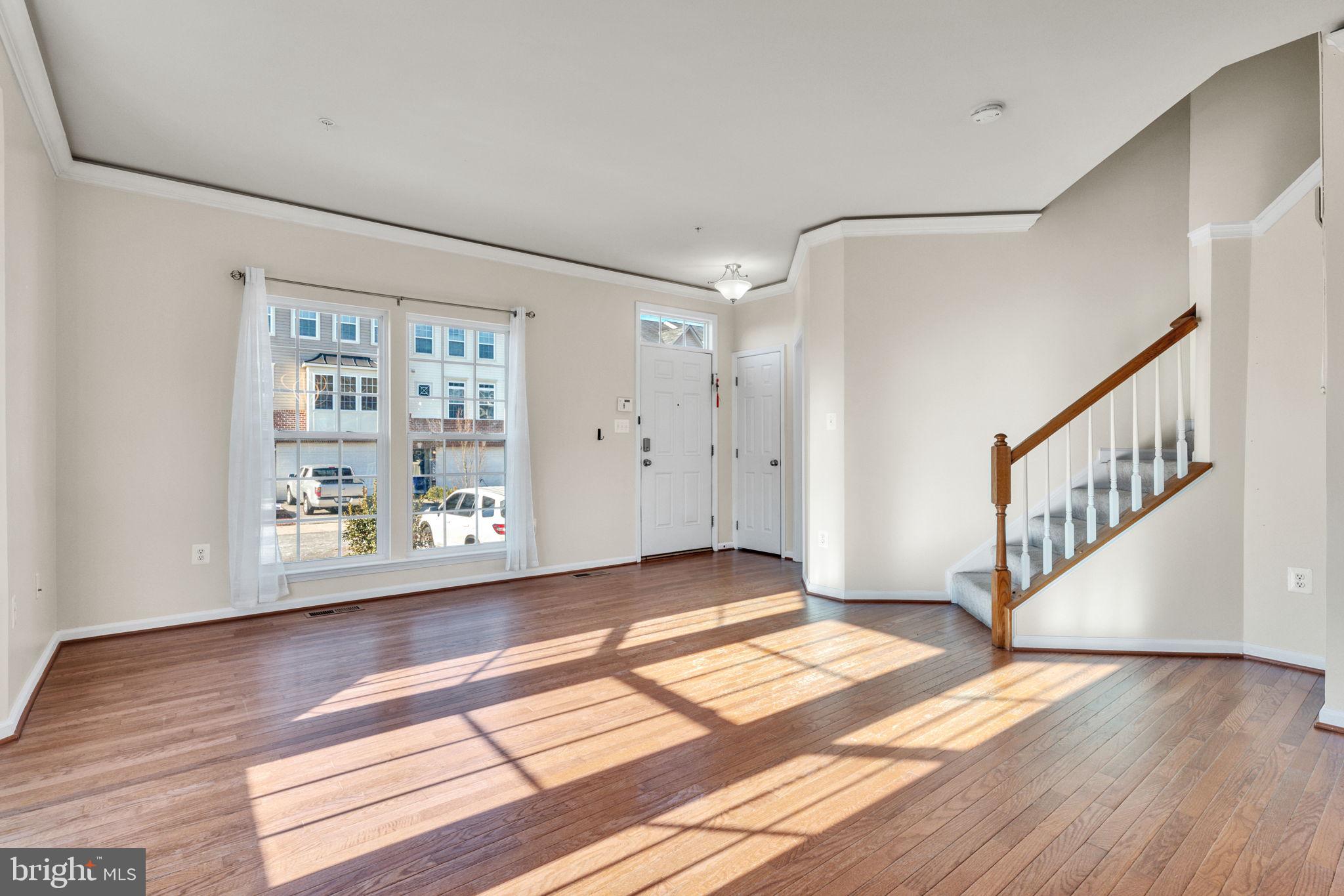25501 Joy Lane Damascus, MD 20872 - Photo 13 of 35 a view of an empty room with wooden floor and a window