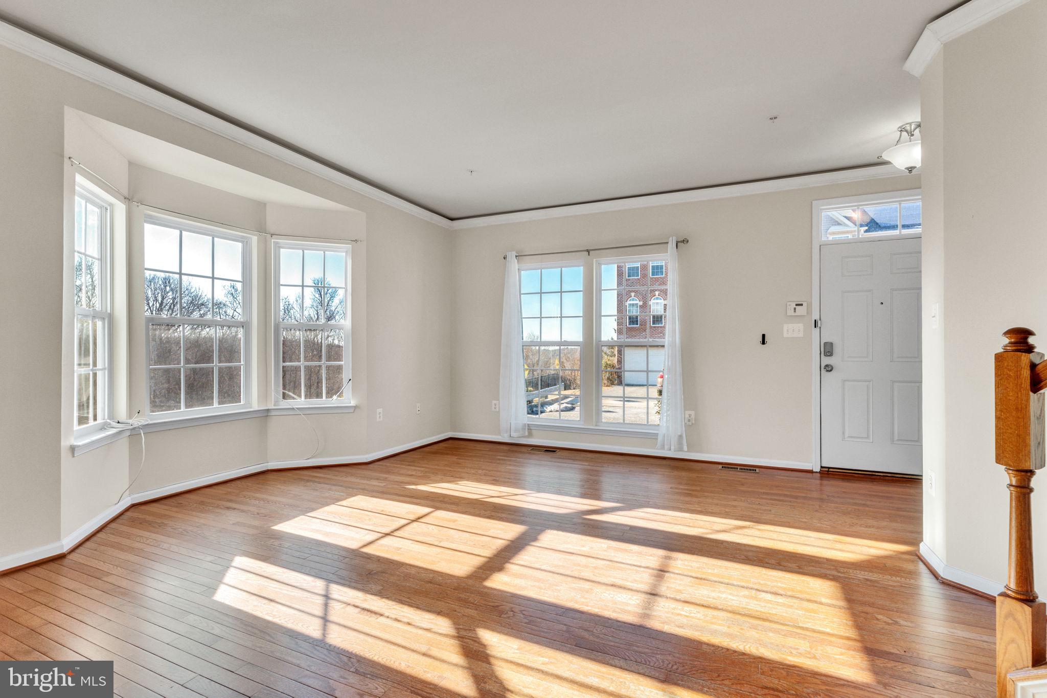 25501 Joy Lane Damascus, MD 20872 - Photo 14 of 35 a view of an empty room with wooden floor and a window