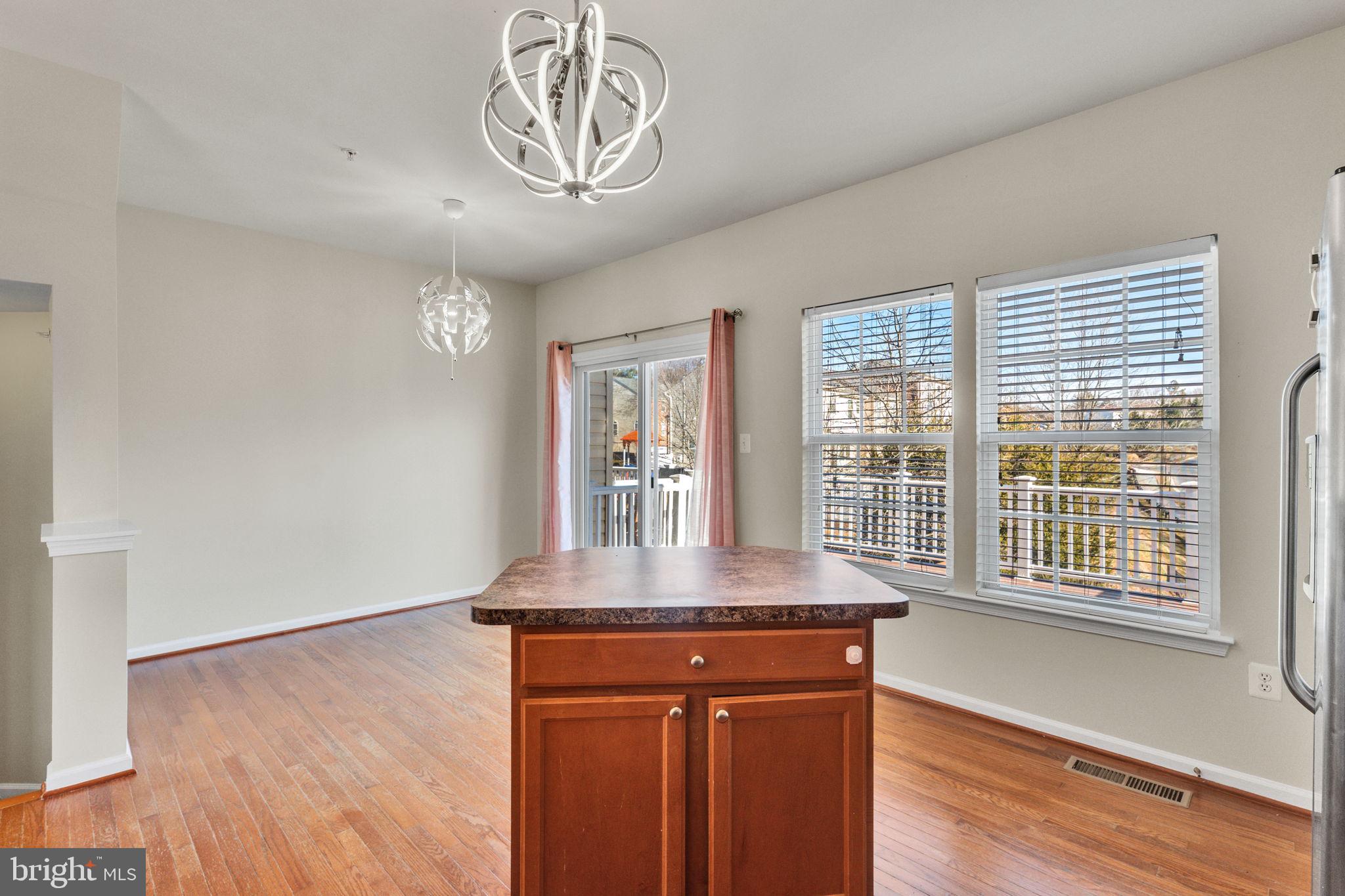25501 Joy Lane Damascus, MD 20872 - Photo 18 of 35 a view of a room with a large window and wooden floor