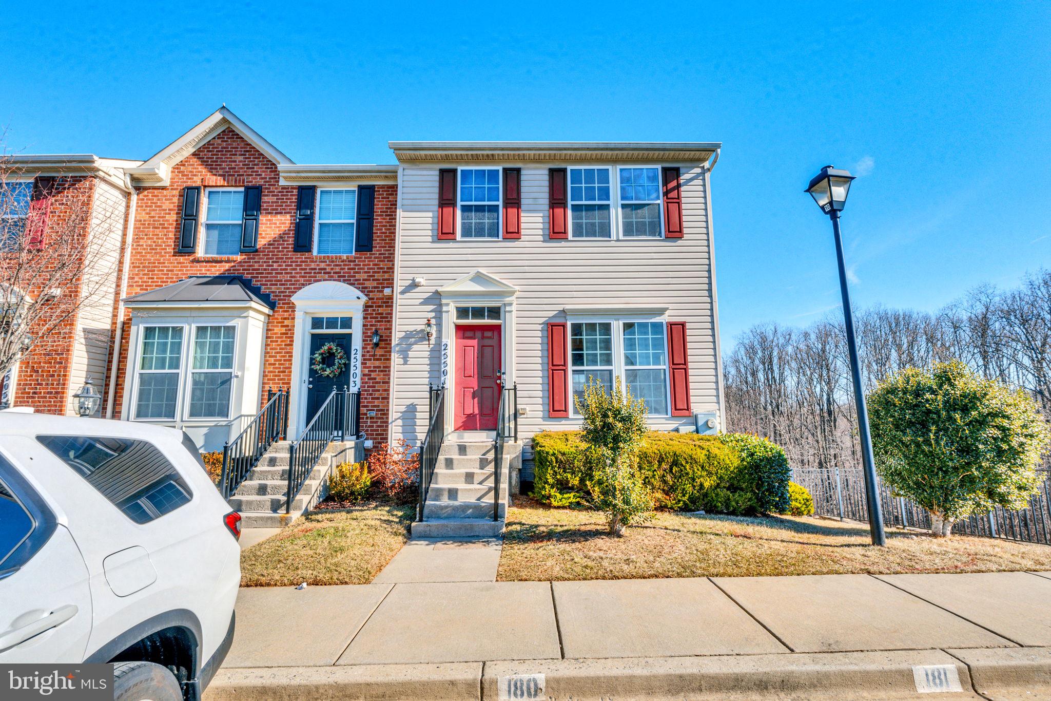 25501 Joy Lane Damascus, MD 20872 - Photo 2 of 35 a front view of a house with a yard and potted plants