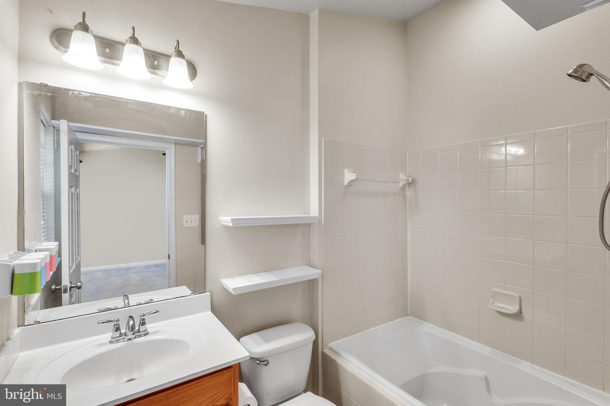 25501 Joy Lane Damascus, MD 20872 - Photo 25 of 35 a bathroom with a sink a toilet and shower