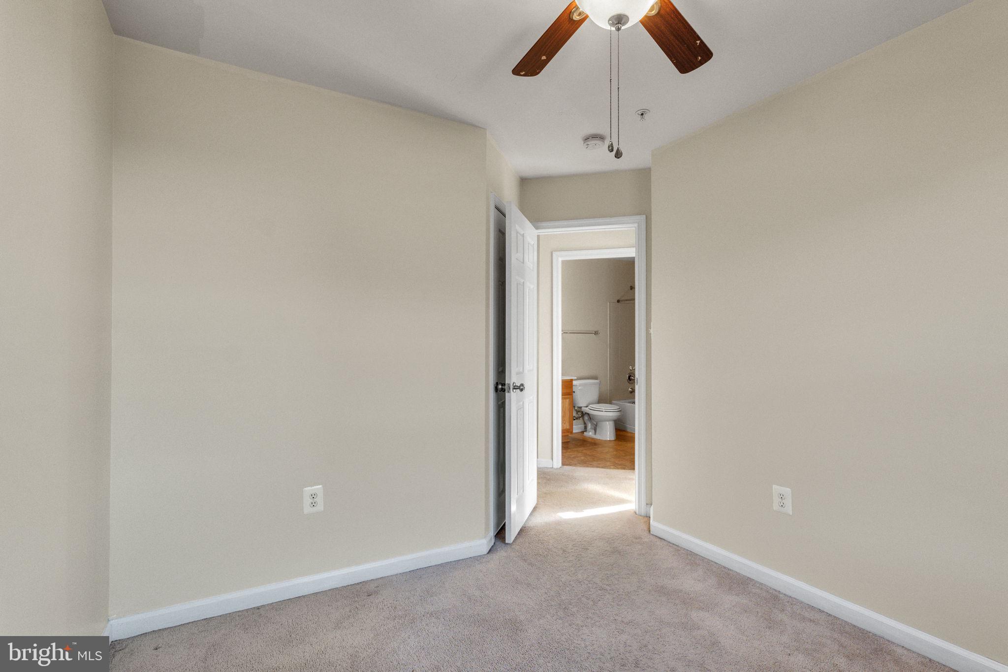 25501 Joy Lane Damascus, MD 20872 - Photo 32 of 35 an empty room with ceiling fan and window