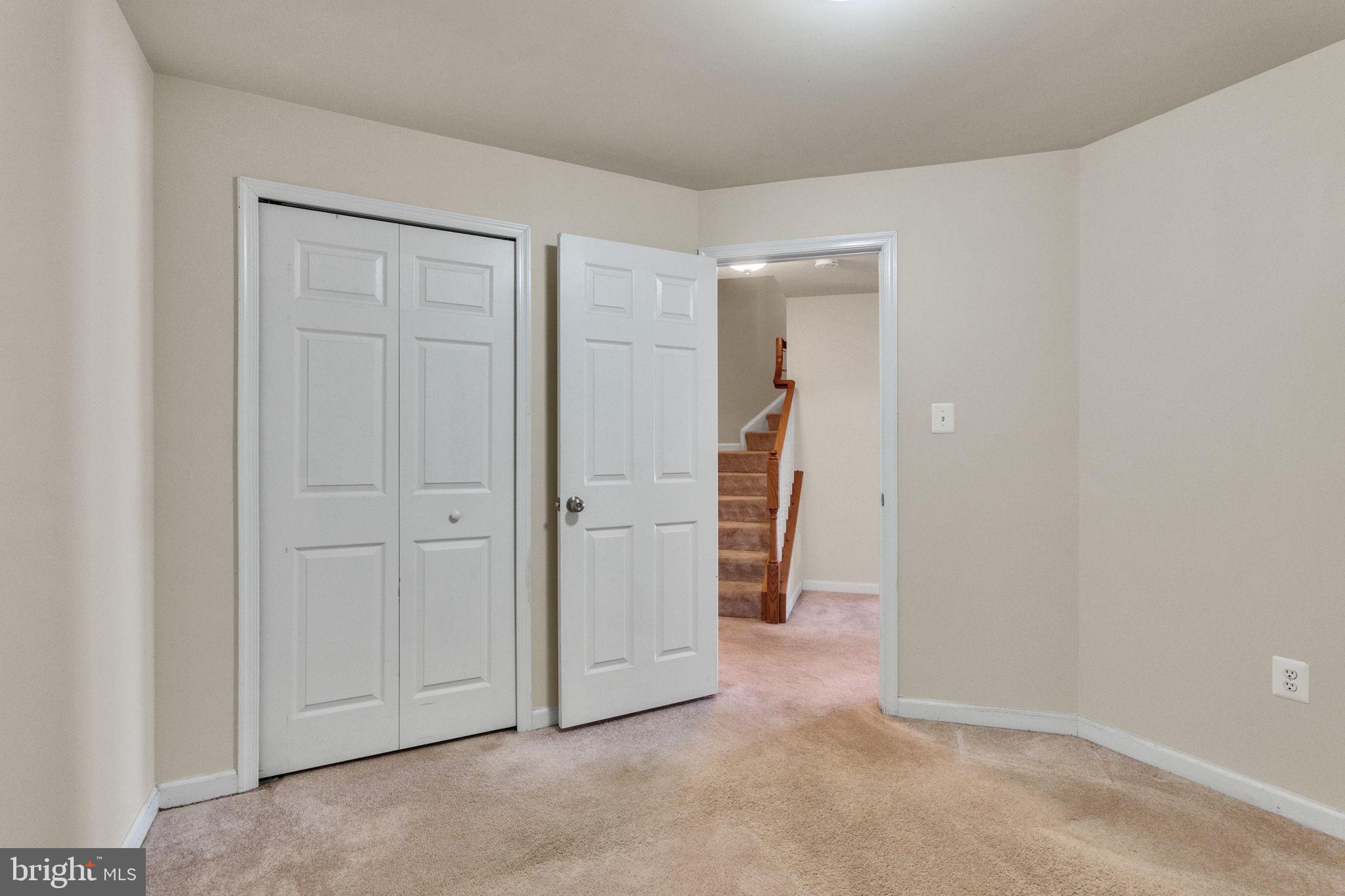 25501 Joy Lane Damascus, MD 20872 - Photo 5 of 35 an empty room with a wooden door