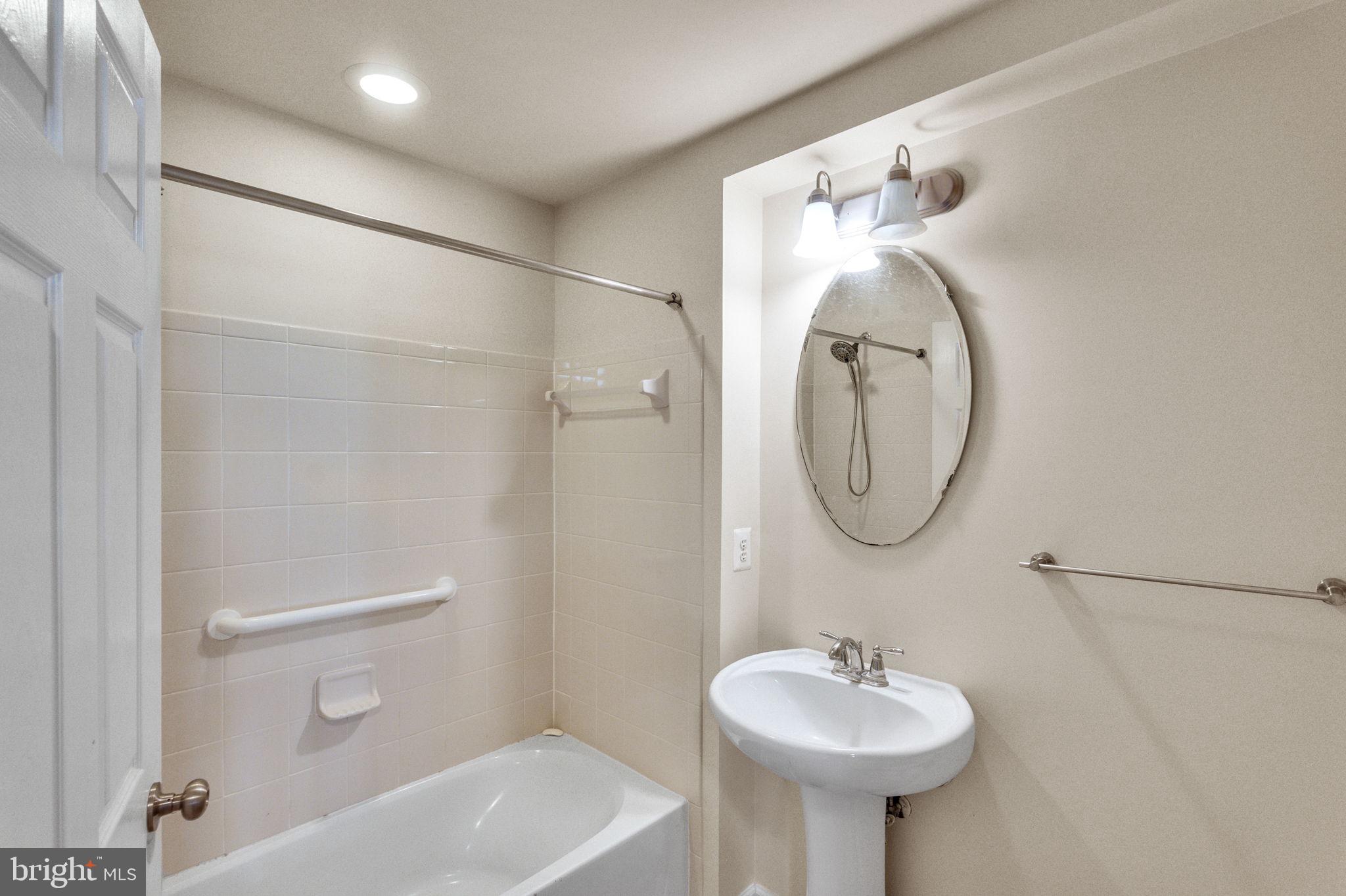 25501 Joy Lane Damascus, MD 20872 - Photo 6 of 35 a bathroom with a sink a toilet and shower