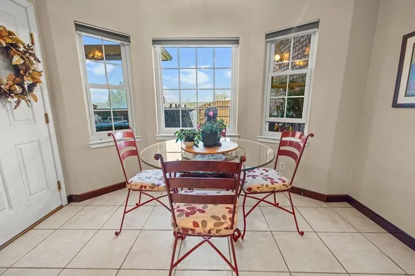 a dining room with furniture and window