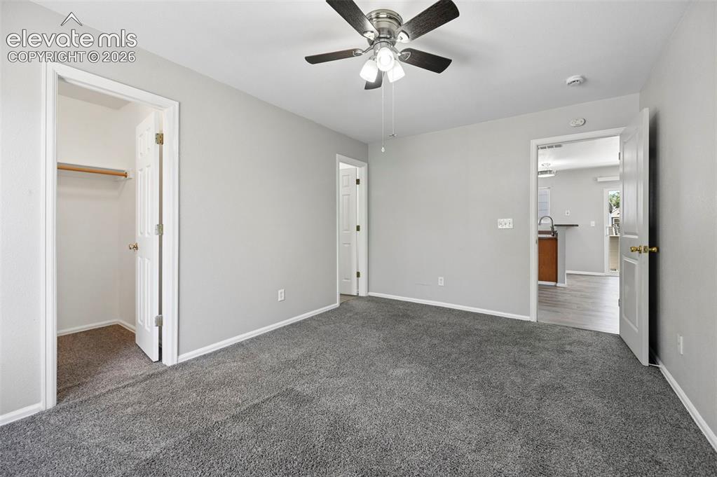 431 Kitfield View Colorado Springs, CO 80916 - Photo 26 of 27 a view of a big room with a chandelier fan and closet area