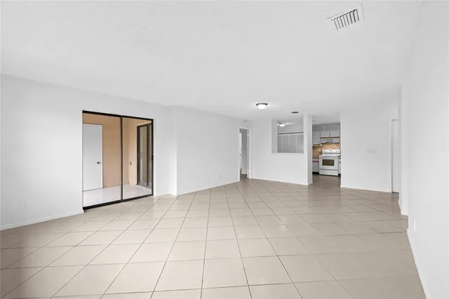 a view of an empty room with a window