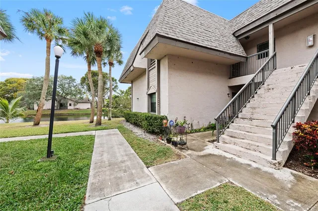 a view of a house with backyard and porch