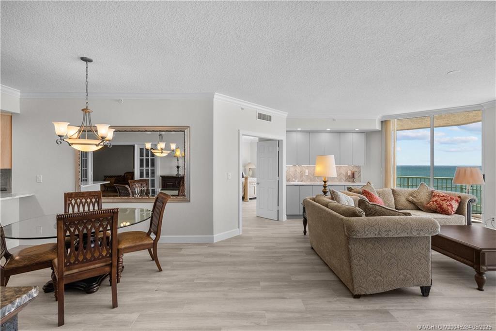 8600 South Ocean Drive, Unit PH5 Jensen Beach, FL 34957 - Photo 12 of 49 a living room with furniture and a wooden floor