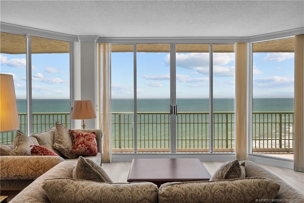8600 South Ocean Drive, Unit PH5 Jensen Beach, FL 34957 - Photo 14 of 49 a living room with furniture and a large window