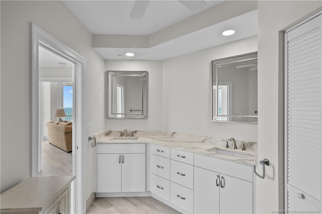 8600 South Ocean Drive, Unit PH5 Jensen Beach, FL 34957 - Photo 26 of 49 a bathroom with a granite countertop sink mirror and double