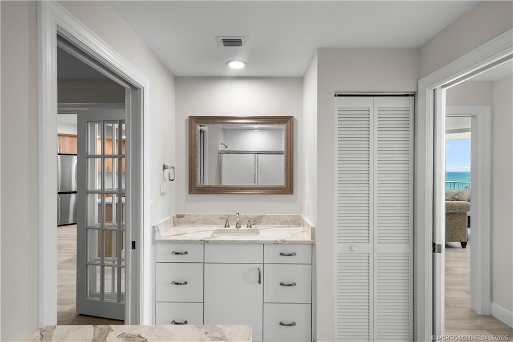 8600 South Ocean Drive, Unit PH5 Jensen Beach, FL 34957 - Photo 27 of 49 a bathroom with a shower sink and mirror