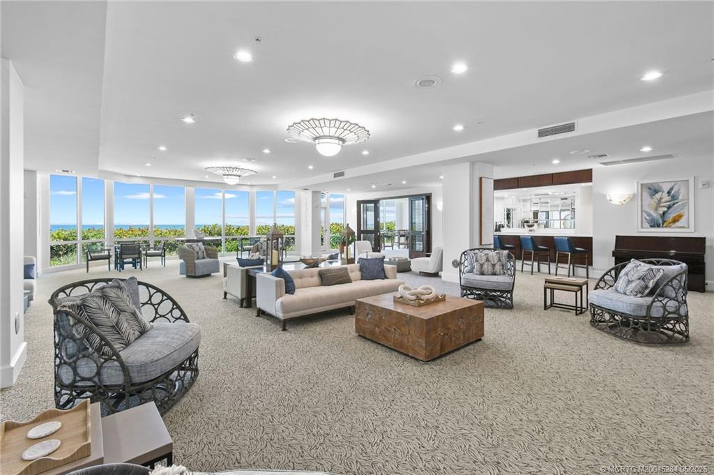 8600 South Ocean Drive, Unit PH5 Jensen Beach, FL 34957 - Photo 38 of 49 a living room with furniture and a large window