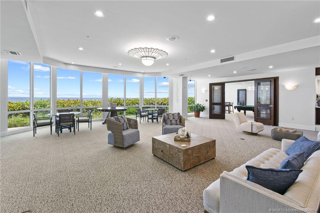 8600 South Ocean Drive, Unit PH5 Jensen Beach, FL 34957 - Photo 39 of 49 a living room with furniture and a large window