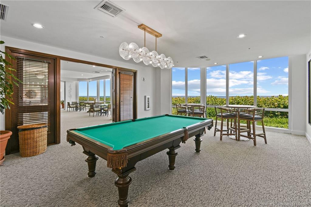 8600 South Ocean Drive, Unit PH5 Jensen Beach, FL 34957 - Photo 42 of 49 a room with pool table and windows