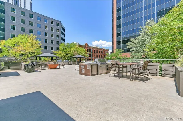 a swimming pool with outdoor seating and yard