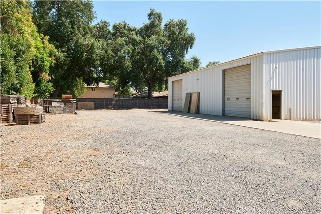 a view of a backyard with tree