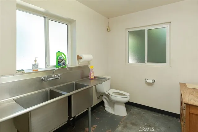 a kitchen with a sink and a mirror