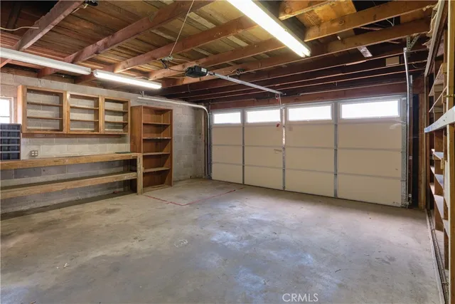 a view of an empty room with furniture