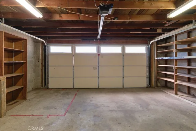 a view of an empty room with a garage
