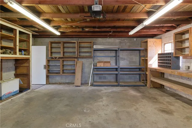 a view of an empty room with storage