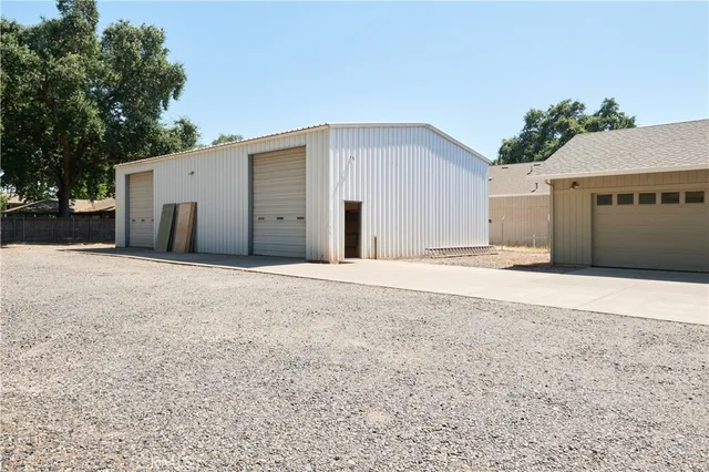 a view of a house with a yard and garage
