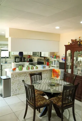 a view of an outdoor dining space with furniture