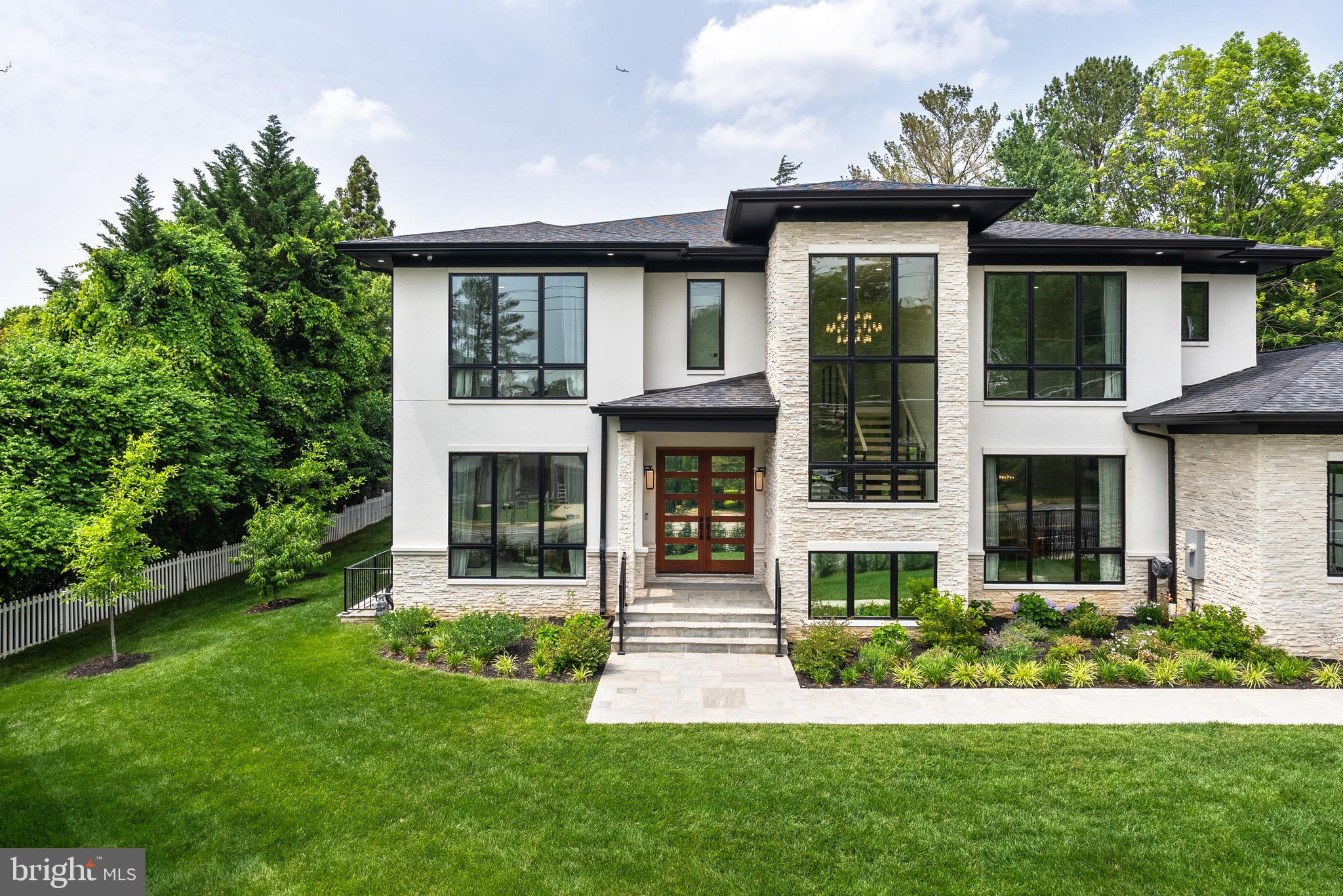 8100 Lewinsville Road McLean, VA 22102 - Photo 13 of 49 a front view of a house with a yard
