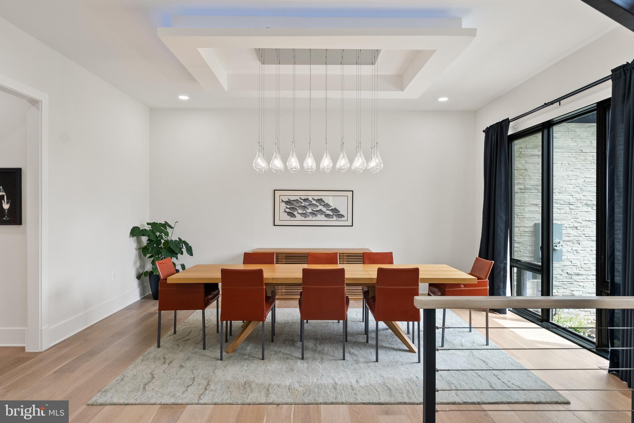 8100 Lewinsville Road McLean, VA 22102 - Photo 16 of 49 a view of a dining room with furniture window and wooden floor