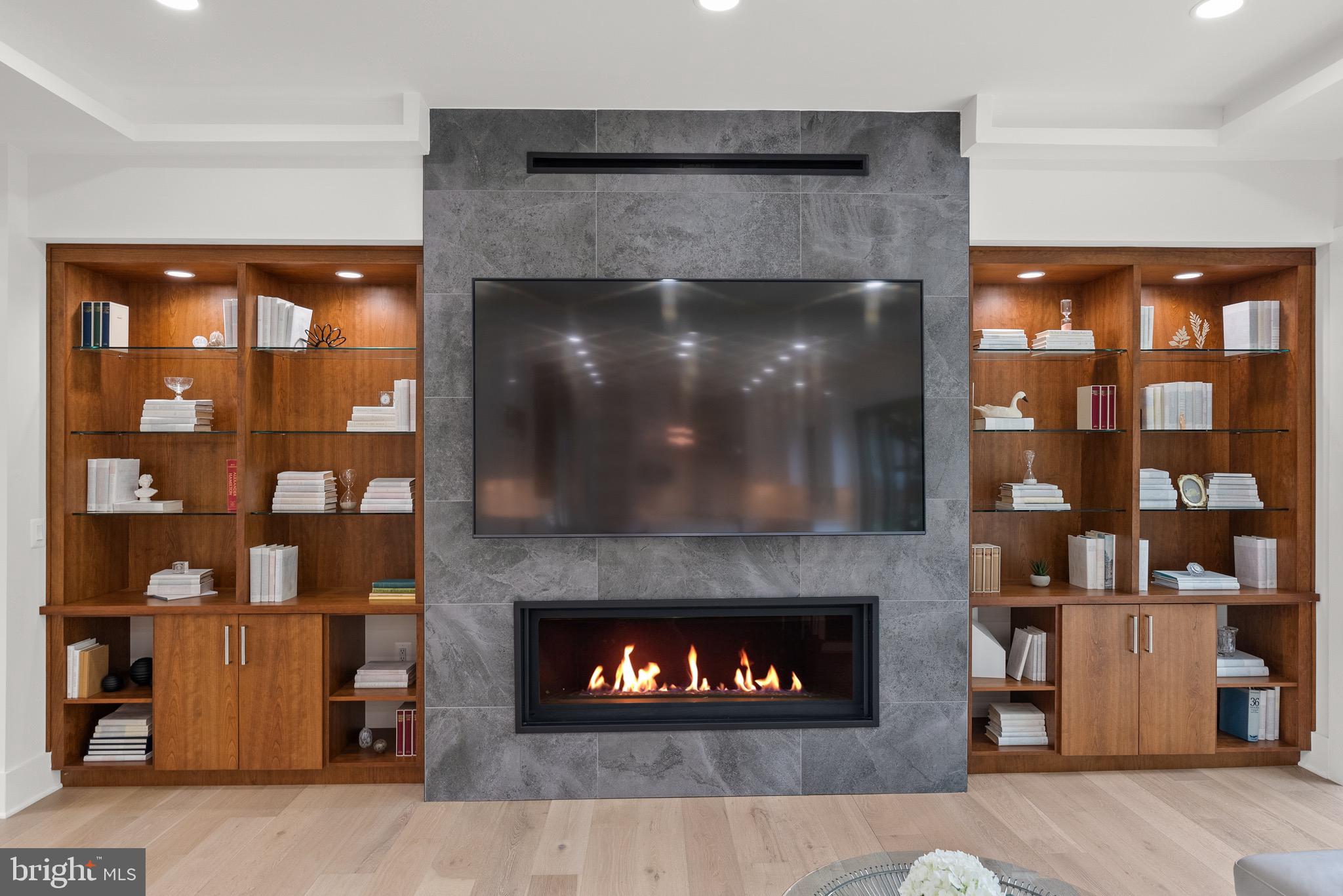 8100 Lewinsville Road McLean, VA 22102 - Photo 20 of 49 a living room with a fireplace and a large window
