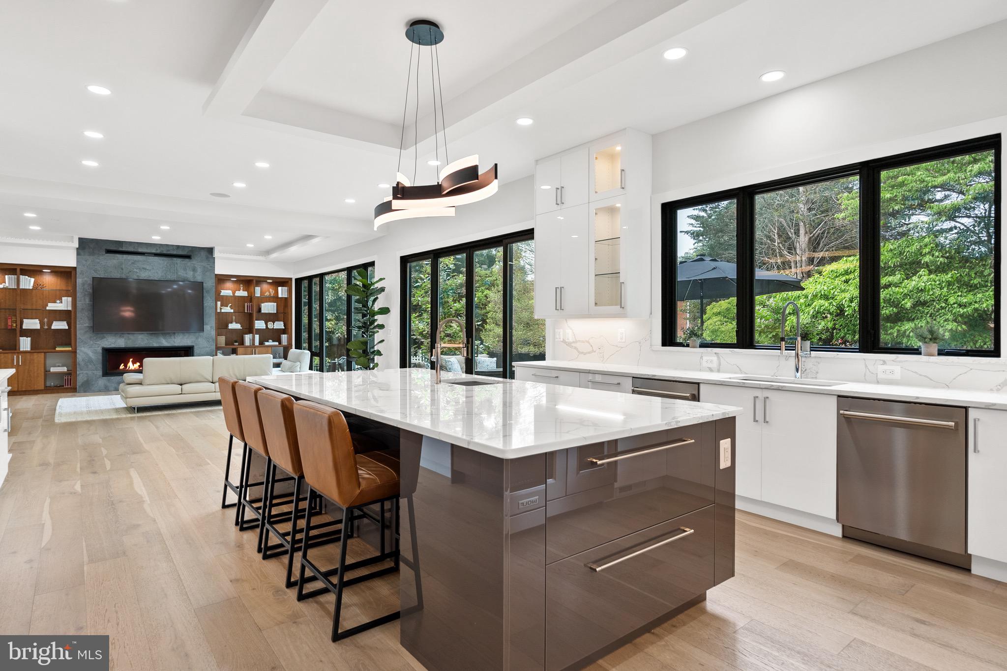 8100 Lewinsville Road McLean, VA 22102 - Photo 22 of 49 a dining hall with stainless steel appliances granite countertop a sink and a large window with wooden floor