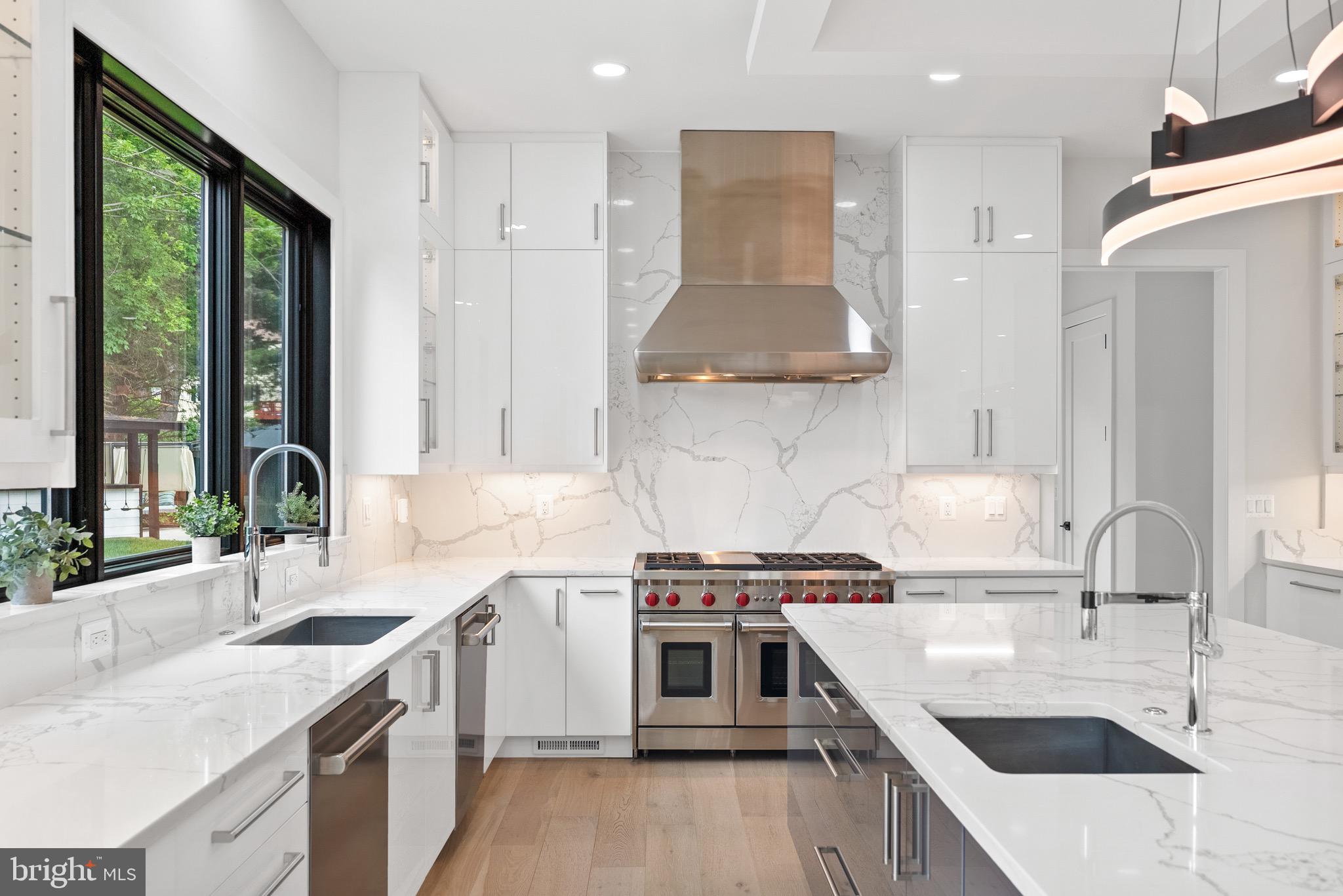 8100 Lewinsville Road McLean, VA 22102 - Photo 24 of 49 a kitchen with a sink a stove and refrigerator
