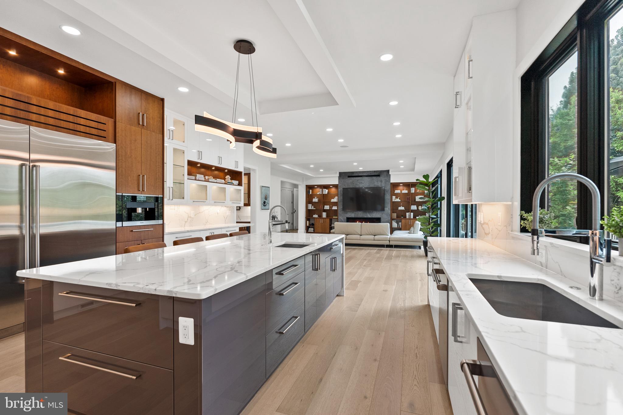 8100 Lewinsville Road McLean, VA 22102 - Photo 25 of 49 a kitchen with stainless steel appliances granite countertop a sink a oven and a refrigerator