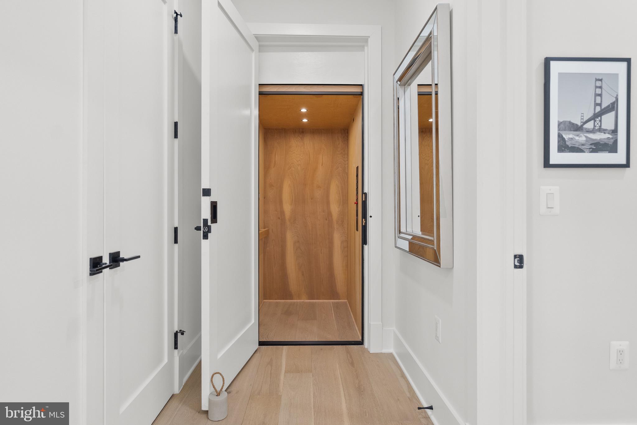 8100 Lewinsville Road McLean, VA 22102 - Photo 28 of 49 a view of a hallway with wooden floor and closet area