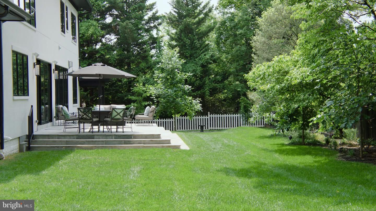 8100 Lewinsville Road McLean, VA 22102 - Photo 3 of 49 a view of a chair and table in the garden