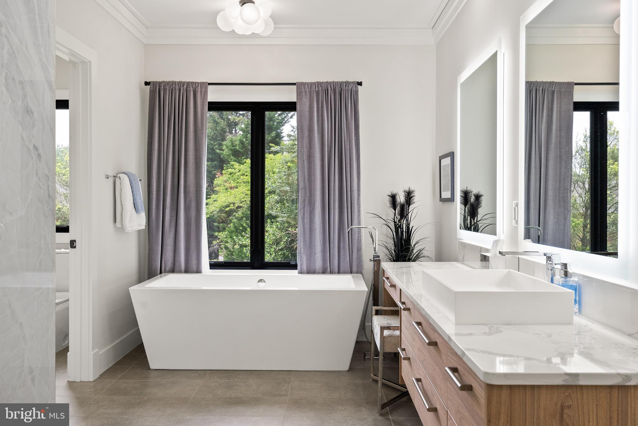 8100 Lewinsville Road McLean, VA 22102 - Photo 37 of 49 a living room with a large window and a table