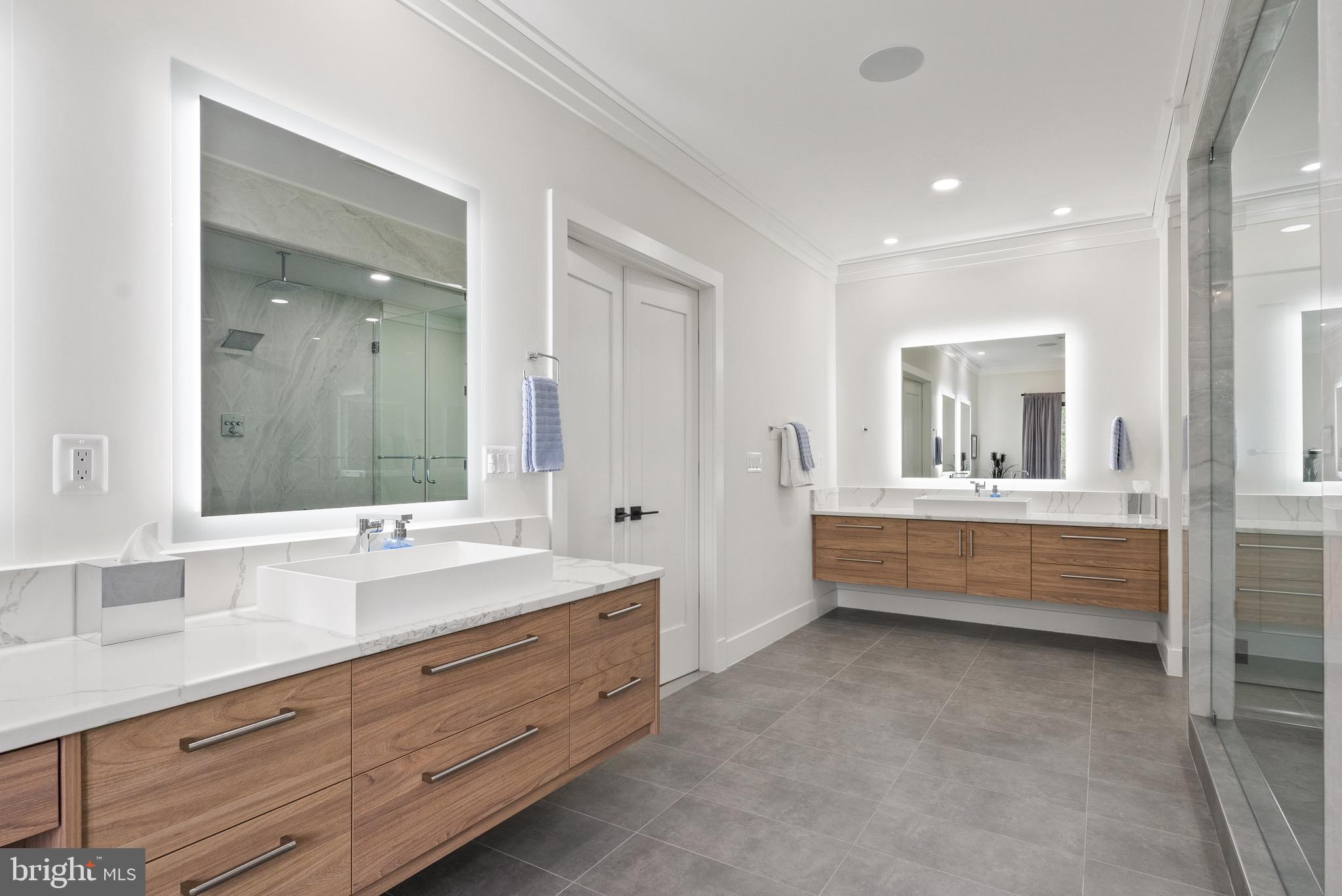 8100 Lewinsville Road McLean, VA 22102 - Photo 38 of 49 a bathroom with a double vanity sink mirror and bathtub