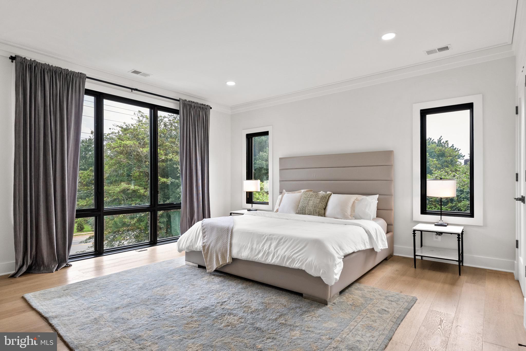 8100 Lewinsville Road McLean, VA 22102 - Photo 40 of 49 a bedroom with a large bed and a large window